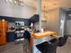 Modern kitchen featuring stainless steel appliances and stylish navy blue cabinets at 3391 S Kirkman Rd # 1236, Orlando, FL 32811