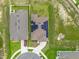 Overhead view of a modern home with solar panels and a manicured lawn at 3405 Yarian Dr, Haines City, FL 33844
