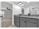 Bathroom featuring a double granite vanity with a shower visible through the doorway at 3405 Yarian Dr, Haines City, FL 33844