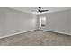 Neutral bedroom with a ceiling fan, one window, and carpeted flooring at 3405 Yarian Dr, Haines City, FL 33844