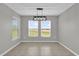 Bright dining room features tile floors, neutral walls, and two windows at 3405 Yarian Dr, Haines City, FL 33844