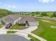 View of single Gathering home with a well-maintained lawn and a two car garage at 3405 Yarian Dr, Haines City, FL 33844
