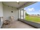 Covered patio with string lights overlooking a grassy backyard at 3405 Yarian Dr, Haines City, FL 33844