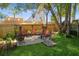 Inviting backyard with a cozy seating area with multiple chairs and a fire pit, perfect for entertaining at 3460 Fairway Ln, Orlando, FL 32804