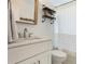 Bright bathroom with white cabinets, a modern sink, and stylish fixtures at 3460 Fairway Ln, Orlando, FL 32804