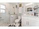 Modern bathroom featuring a tiled shower with glass door and vanity with sink at 3460 Fairway Ln, Orlando, FL 32804