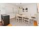 Cozy dining room with natural lighting, neutral decor, and hardwood floors at 3460 Fairway Ln, Orlando, FL 32804