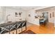 Dining room with views of the kitchen, wooden floors, and light-colored walls at 3460 Fairway Ln, Orlando, FL 32804
