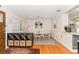 Dining room with a round table, white chairs, and views of the kitchen at 3460 Fairway Ln, Orlando, FL 32804