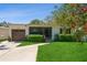 Charming single-story home with manicured lawn and lush landscaping at 3460 Fairway Ln, Orlando, FL 32804