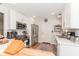 Bright kitchen with white cabinets, stainless steel appliances, and hardwood floors at 3460 Fairway Ln, Orlando, FL 32804