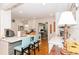 Bright kitchen with breakfast bar, white cabinets, and hardwood floors at 3460 Fairway Ln, Orlando, FL 32804