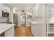Bright kitchen featuring stainless steel appliances, white cabinets, and hardwood floors at 3460 Fairway Ln, Orlando, FL 32804
