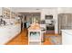 Spacious kitchen with center island, stainless appliances, and hardwood floors at 3460 Fairway Ln, Orlando, FL 32804