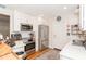 Modern kitchen featuring white cabinets, stainless appliances, and hardwood floors at 3460 Fairway Ln, Orlando, FL 32804