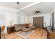 Comfortable living room with a sectional sofa, ottoman, and laminated floors at 3460 Fairway Ln, Orlando, FL 32804
