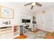 Bright home office with natural light, built-in storage, and hardwood floors at 3460 Fairway Ln, Orlando, FL 32804