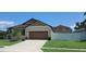 Charming single-story home with well-manicured lawn and a two-car garage at 3529 Harlequin Dr, St Cloud, FL 34772