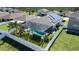 Aerial view of backyard featuring a sparkling screened-in pool and fenced yard at 356 Nova Dr, Davenport, FL 33837