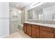 Modern bathroom featuring a glass-enclosed shower, double sinks, and granite countertops at 356 Nova Dr, Davenport, FL 33837