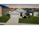 Charming single-Gathering home features a well-manicured lawn and attached two-car garage at 356 Nova Dr, Davenport, FL 33837