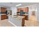 Spacious kitchen boasts stainless steel appliances, granite countertops, and a center island at 356 Nova Dr, Davenport, FL 33837