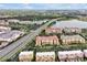 A picturesque aerial view of community townhomes near a beautiful lake at 4816 Tidecrest Ave # 178, Orlando, FL 32819