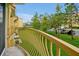 Serene balcony view overlooking well-maintained landscaping, trees, and parking at 4816 Tidecrest Ave # 178, Orlando, FL 32819