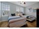 Bedroom with two beds, wood floors and window at 4816 Tidecrest Ave # 178, Orlando, FL 32819