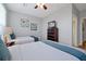 Bedroom with two beds, wood floors and a TV on a chest of drawers at 4816 Tidecrest Ave # 178, Orlando, FL 32819