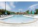 A community pool offers residents a refreshing space to relax and socialize in a tropical setting at 4816 Tidecrest Ave # 178, Orlando, FL 32819