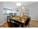 Inviting dining area with a spacious table, comfortable seating, and modern lighting at 4816 Tidecrest Ave # 178, Orlando, FL 32819