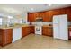 Bright kitchen featuring ample cabinet space, modern appliances, and tile flooring at 4816 Tidecrest Ave # 178, Orlando, FL 32819