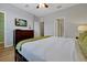 Spacious main bedroom with a comfortable bed, and well-lit space at 4816 Tidecrest Ave # 178, Orlando, FL 32819
