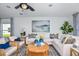 Bright living room offers stylish decor, comfortable seating and plenty of natural light at 483 Wayland Dr, Haines City, FL 33844