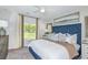 Cozy main bedroom featuring large window, tasteful decor, and plenty of natural light at 483 Wayland Dr, Haines City, FL 33844