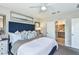 Main bedroom features stylish decor, a large window, and an ensuite bathroom at 483 Wayland Dr, Haines City, FL 33844