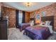 Themed bedroom featuring two twin beds, Harry Potter decor, and brick-patterned wallpaper at 4834 Lullaby Ln, Kissimmee, FL 34746
