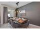 Well-lit dining area with elegant table setting, contemporary lighting, and sliding glass doors at 4834 Lullaby Ln, Kissimmee, FL 34746