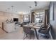 Open concept dining and living space with modern decor and abundant natural light at 4834 Lullaby Ln, Kissimmee, FL 34746