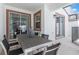 Enjoy this covered patio with dining table, view of the pool and access to the home at 4834 Lullaby Ln, Kissimmee, FL 34746