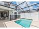 Inviting screened-in pool area features a safety fence, patio dining and offers great outdoor space at 4834 Lullaby Ln, Kissimmee, FL 34746