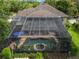 Aerial view of the screened-in pool with spa and the home's backyard and patio at 490 Wekiva Preserve Dr, Apopka, FL 32712