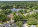 Aerial view of home highlighting property lines, lake, and surrounding landscape at 490 Wekiva Preserve Dr, Apopka, FL 32712