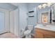 Light blue bathroom with a single sink vanity, toilet, and shower with white curtain at 490 Wekiva Preserve Dr, Apopka, FL 32712