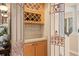 Butler's pantry offers plenty of wine storage and glass shelving at 490 Wekiva Preserve Dr, Apopka, FL 32712