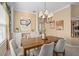 Elegant dining room with a wooden table, stylish chairs, and decorative lighting at 490 Wekiva Preserve Dr, Apopka, FL 32712
