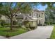 Beautiful two-story home with well-manicured lawn, mature trees, and a spacious driveway at 490 Wekiva Preserve Dr, Apopka, FL 32712