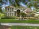 Charming two-story home with lush landscaping and a well-manicured lawn at 490 Wekiva Preserve Dr, Apopka, FL 32712