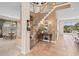 Welcoming foyer with staircase, tile flooring, and views into the dining and living areas at 490 Wekiva Preserve Dr, Apopka, FL 32712